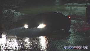 Car sliding on brick street